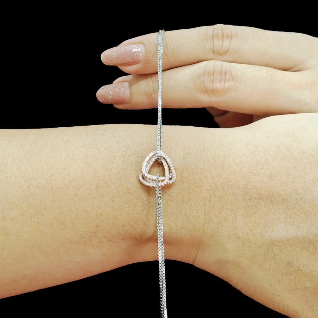 Triangle Trio Dual Tone Bracelet in sterling silver with interlocked triangle charms and dual-layered chain