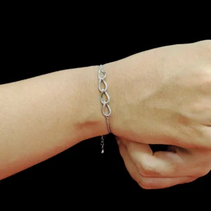 Infinity link bracelet in sterling silver with zircon-studded design and classic chain
