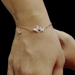 Butterfly charm bracelet in 925 sterling silver with rose gold finish and hanging butterfly charm