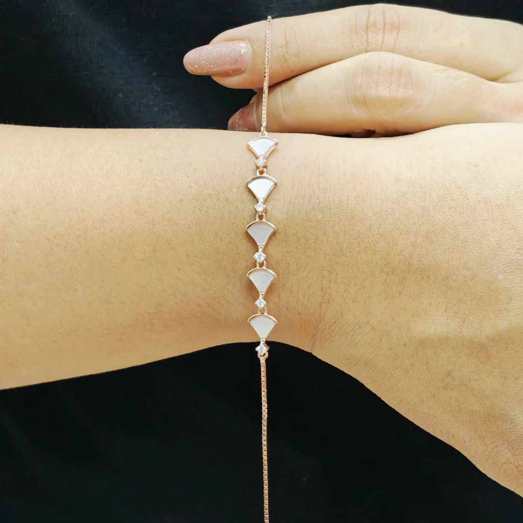 Rose gold bracelet with traditional hand fan design and mother of pearl inlay
