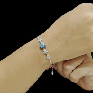 Azure bloom bracelet in sterling silver with blue crystal heart and stone-studded flowers