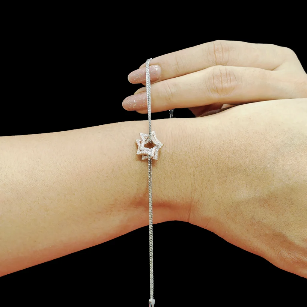Twinkle Star Dual Tone Bracelet with zircon-studded interlocked stars in sterling silver