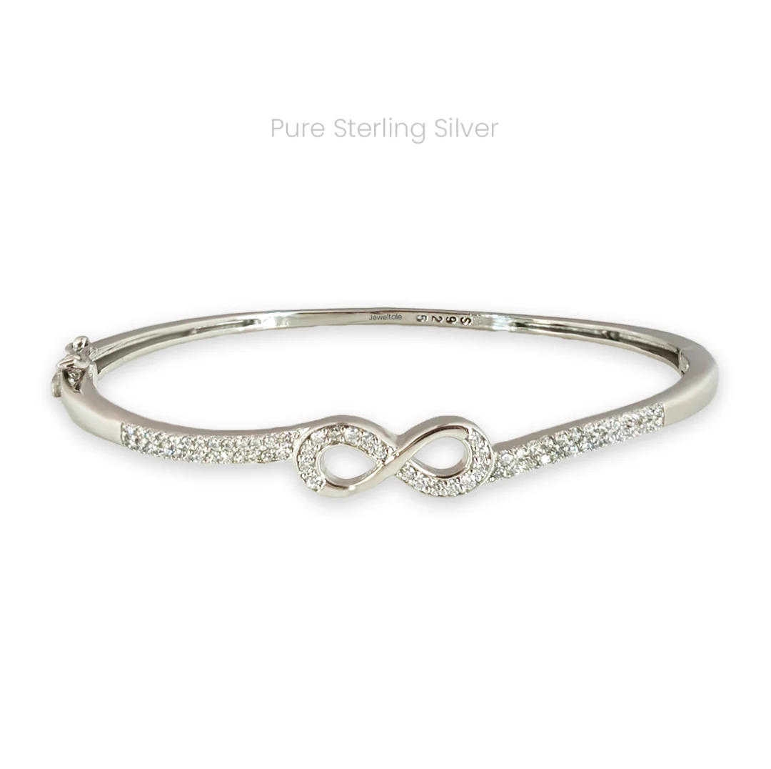 Minimal sterling silver cuff bracelet with zircon-studded infinity symbols on both ends