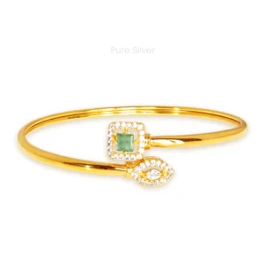 Gold finished twister bangle with light blue and white stones and zircon detailing – Minted Spark design