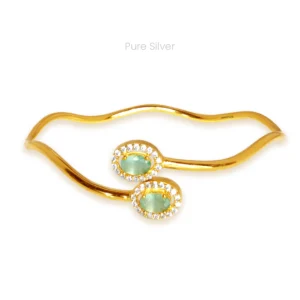 Sterling silver infinity twirl twister bangle with wavy design, blue stones, and zircon-studded ends