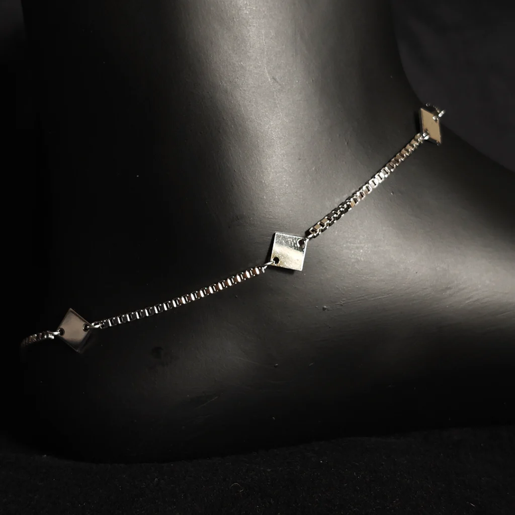 Sterling silver anklet with dangling diamond-shaped motifs
