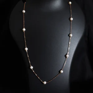 Single layer pearl necklace in rose gold sterling silver with pearls throughout the chain