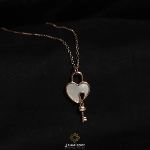 Rose gold sterling silver heart pendant with mother of pearl and key charm