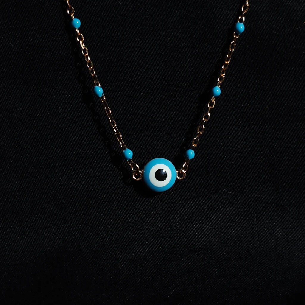 Serene protector necklace in 925 sterling silver with blue beads and evil eye pendant in rose gold