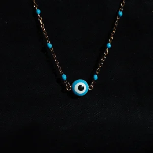 Serene protector necklace in 925 sterling silver with blue beads and evil eye pendant in rose gold