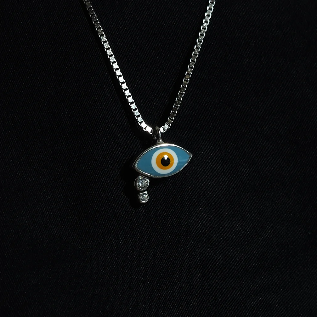 Mystic eye pendant in 925 sterling silver with blue centre and zircon stones on silver chain