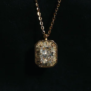 Rose gold chain with a white solitaire pendant and cubic zircon accents.