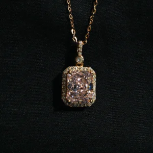 Princess cut pink gemstone pendant in rose gold with cubic zircons and silver chain
