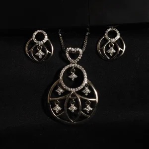 Abstract pendant and earring set in sterling silver with zircon accents