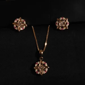 Rose gold star-shaped pendant set with white and red stones in sterling silver