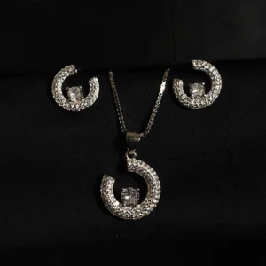 Abstract pendant and earring set in sterling silver with zircon accents