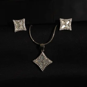 Star-shaped pendant and earring set in sterling silver with mother of pearl and zircons