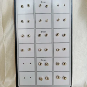 Assorted minimal sterling silver studs and drop earrings for daily wear