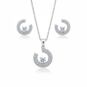 Abstract pendant and earring set in sterling silver with zircon accents